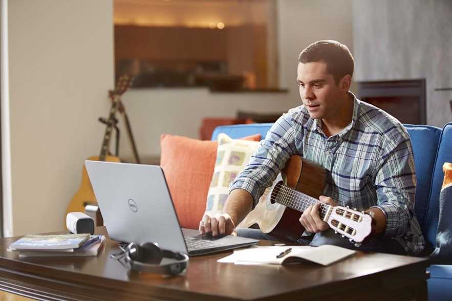 Man Playing Guitar with Inspiron 15 5000 Series Notebook